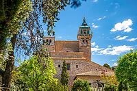 Iglesia de la Cartuja Church Tower, Valldemossa, Majorca, during sunny day with trees in front, horizontal shot, Mallorca [IBR125536407]