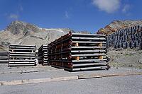 Solar panels lying on ground with vertically mounted four wings around central column, photovoltaic plant avoid snow accumulation, maintain high yields, Alps, future innovation energy concept [IBR125536411]