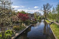 Giethoorn Netherlands, city skyline at canal and traditional house in Giethoorn village [IBR125536425]