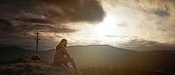 Woman in the distance on a small summit [IBR125536459]