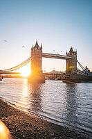 Tower Bridge spans over the Thames as the sun sets on the shore, Tower Bridge, London, United Kingdom [IBR125536470]