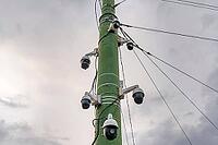 A panoramic view of a pole with surveillance cameras installed, showing the city's situation [IBR125557539]
