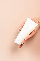 Cream mockup closeup product presentation, holding hand, beauty product [IBR125557546]