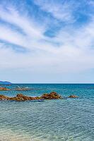 Sa Figu beach with rocks of turquoise water in Sardinia, Italy [IBR125557613]