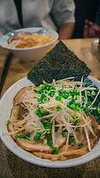 A bowl of Cha chaan teng set with toppings like green onions and seaweed, a classic breakfast food in Hong Kong [IBR125565989]