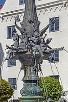 The town hall fountain is a heritage-protected running water fountain, detail of the column, water-spouting putti and dolphins, below the Akanthus leaves, Kempten, Allgäu, Bavaria, Germany [IBR125565995]