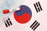 Concept of Novel Coronavirus spreading from China to South Korea - 2019-nCoV or Covid-19 disease positive test on South Korea flag with blood sample [IBR125566005]