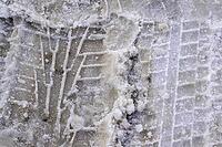 Tire tracks on snowy road.Road covered with snow, winter driving [IBR125566064]