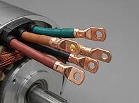 Color-coded conductors emerge from a motor stator, alongside copper lugs, exposed winding coils, and a machined shaft on a neutral gray background, AI generated [IBR125592696]