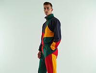Fashionable model wearing a vibrant, geometric tracksuit, showcasing modern streetwear style, AI generated [IBR125592725]