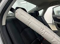 Inflatable seatbelt airbag deploying inside a modern car, demonstrating a crucial safety system designed for occupant protection during an accident or impact, providing enhanced vehicle crash safety, AI generated [IBR125592735]