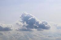 Beautiful fluffy white beautiful cloud formations in a deep blue summer sky [IBR125606071]