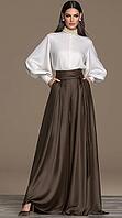 Elegant woman in white balloon sleeve blouse and chocolate brown satin wide leg palazzo pants. AI generated [IBR125621282]