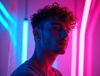 Young man surrounded by vibrant neon lights in futuristic ambiance, AI generated [IBR125621327]