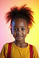 Studio portrait of a smiling young african american girl with afro hairstyle, posing confidently against a vibrant and colorful backdrop, AI generated [IBR125621351]