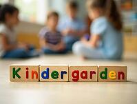 Colorful wooden blocks spelling kindergarten with blurred preschool children playing in the background, AI generated [IBR125621373]