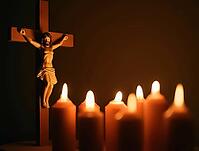 Jesus figure on a crucifix surrounded by glowing candles, AI generated [IBR125636876]