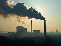 Smoke billowing from industrial chimneys pollutes the atmosphere, obscuring the horizon and symbolizing environmental damage, AI generated [IBR125636905]