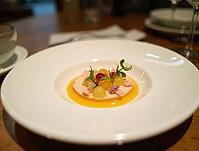 Exquisite single bite-sized masterpiece featuring molecular gastronomy on a high-end tasting menu plate, AI generated [IBR125636917]