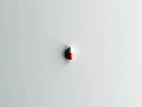 Minimalist composition featuring a single pill in the center of a clean sterile background, AI generated [IBR125636943]