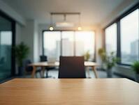 Wooden desk in the foreground with blurred modern office background, ideal for displaying products or showcasing workspace designs, AI generated [IBR125636955]