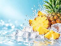 Juicy pineapple slices and pieces lie with ice cube cubes in the splashing water against a light blue background, AI generated [IBR125645919]