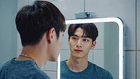 Young man admiring his reflection in a sleek, modern bathroom mirror while focusing on grooming and enhancing his appearance, AI generated [IBR125653452]