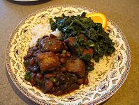 Traditional brazilian feijoada served with rice, collard greens, and orange slices, offering a vibrant culinary experience, AI generated [IBR125653464]