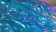 Glossy and shiny blue slime featuring playful bubbles and unique textures, creating a visually satisfying and vibrant abstract background, AI generated [IBR125653473]