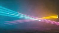 Colorful light beams are crossing in a smoky atmosphere, creating a vibrant and dynamic stage lighting setup, AI generated [IBR125653474]