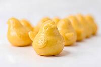 Golden yellow chick shaped buns in a row, Hiyoko manju, Chick shaped manju, white bean paste and sponge, Fukuoka, Kyushu, Japan, dessert, confectionery, food photography, AI generated [IBR125653477]