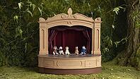 Five charming handmade knitted puppets sitting on stage of miniature theater in lush enchanted forest setting, creating whimsical and magical scene, AI generated [IBR125653493]