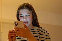 Young girl, teenager on mobile phone, Mecklenburg-Western Pomerania, Germany [IBR125657375]