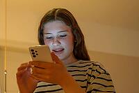 Young girl, teenager on mobile phone, Mecklenburg-Western Pomerania, Germany [IBR125657381]