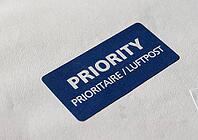 Priority (Prioritaire) mail label tag on a letter for airmail (Luftpost) [IBR125659428]