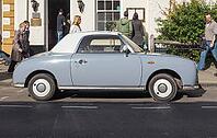 STRATFORD UPON AVON, UK - SEPTEMBER 26, 2015: Figaro is a small retro car manufactured by Nissan resembling the aesthetics of the sixties cars [IBR125659454]