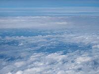Dramatic overcast stormy sky cloudscape seen from an aircraft useful as a background [IBR125659467]