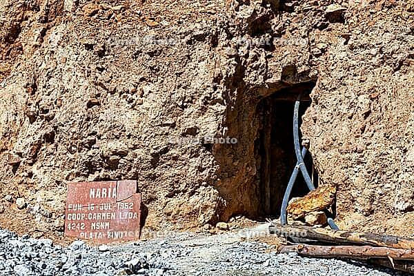 Mine entrance with shield and metallic beams in a rocky environment, The silver mines of Potosi Bolivia [IBR123416440]