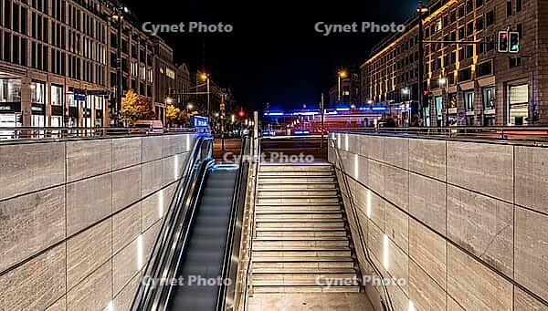 Night photo, long exposure with motion blur, modern underground entrance at Unter den Linden station, contemporary design with stairs and escalator, Berlin, Germany [IBR112672582]