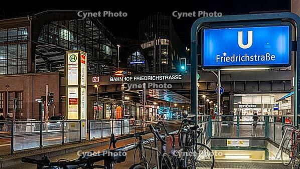 Night photo, long exposure at Friedrichstraße S-Bahn and metro station, in the centre runs the tram line M 12, Berlin, Germany [IBR112672617]
