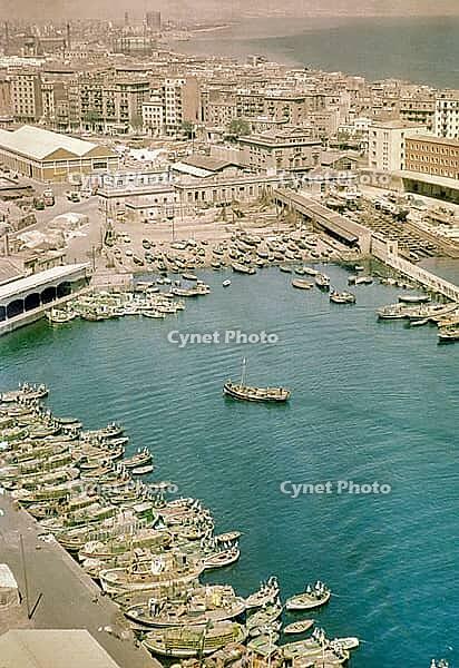 View from cable car of boats and buildings in fishing port, Barceloneta area of Barcelona, Spain, Europe 1965 [IBR112672625]