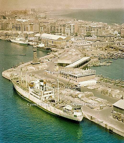 View from cable car of cargo ship 'Fylgia' in port, view to Barceloneta area, city of Barcelona, Spain Europe 1965 [IBR112672627]