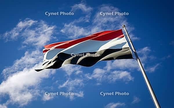 Beautiful national state flag of Yemen fluttering at sky background. Low angle close-up Yemen flag 3D artwork [IBR123569261]