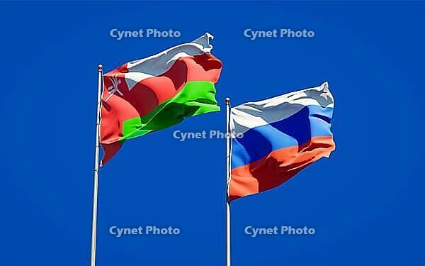 Beautiful national state flags of Oman and Russia together at the sky background. 3D artwork concept [IBR123569274]