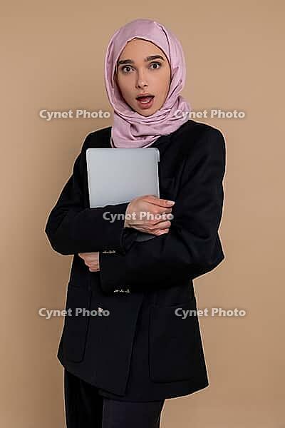 Business woman. Cute young business woman with a laptop [IBR123569313]