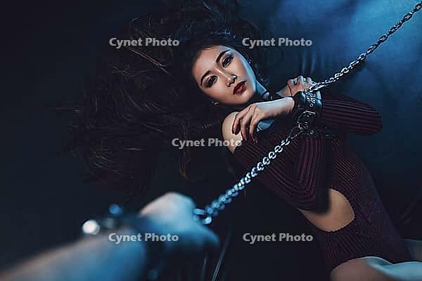 Young asian woman with chain sexy bdsm style portrait. Male hand holding chain [IBR123569347]