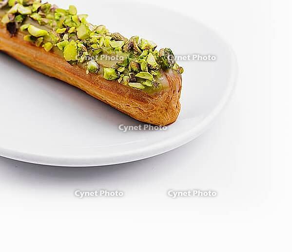 Food, Delicious eclair with pistachio and cream [IBR123622477]