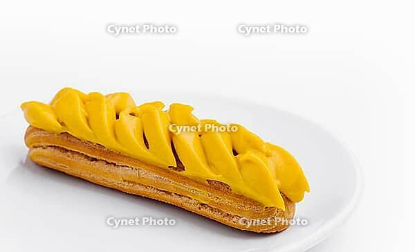 Food, Eclair with Mango Cream on White Plate [IBR123622481]