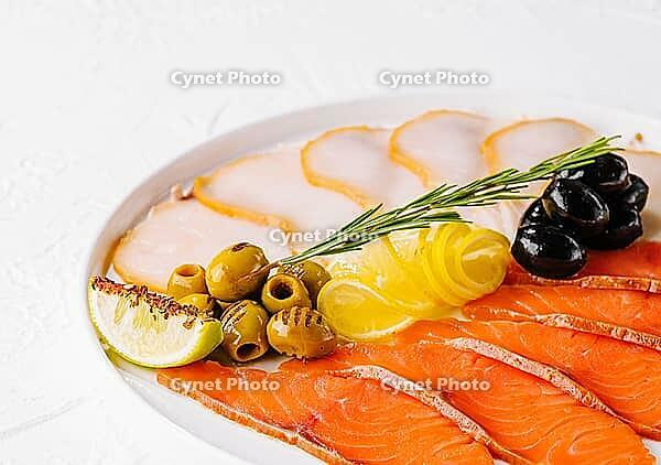 Food, Salmon, white fish and olives on plate [IBR123622484]