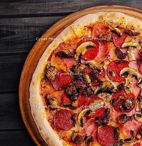 Food, Pepperoni pizza with mushrooms on wood background [IBR123622494]